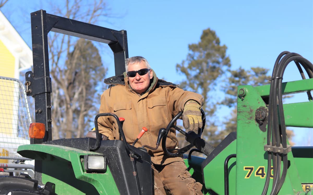 Owner-operator at the controls of his loader tractor